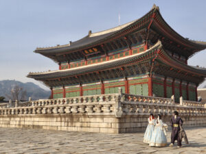 Gyeongbokgung Palace in Seoul with visitors in hanbok