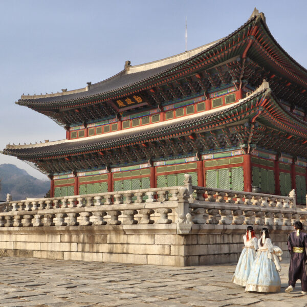 Gyeongbokgung Palace in Seoul with visitors in hanbok
