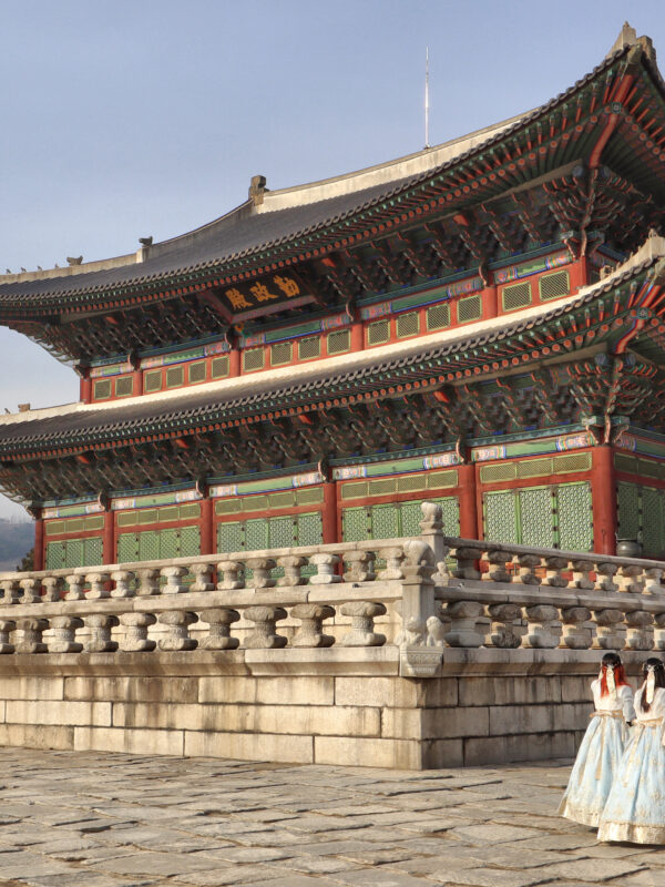 Gyeongbokgung Palace in Seoul with visitors in hanbok