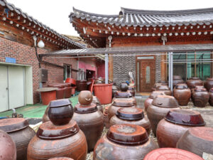 Earthenware onggi jars in a Korean temple courtyard
